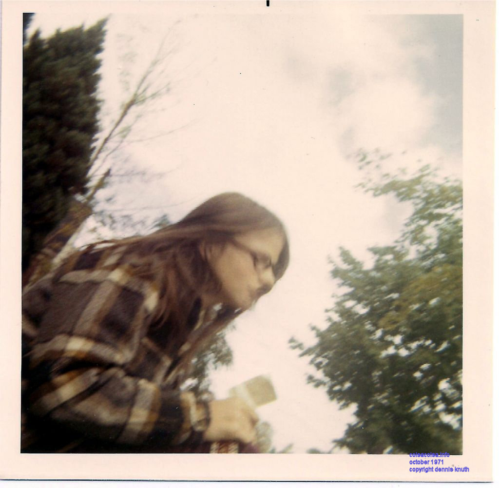 Donadean Sherri setting on a lawn waiting