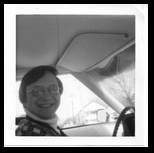 Dennis smiling in his brand new Pontiac