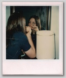 Using the eye lash curler before putting the gown on