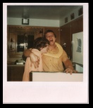 Tom and Peggy Laugh with the Refrigerator Door Open