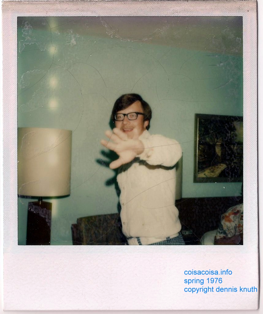 Dennis tries to block the photo