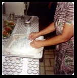 Albertina makes a cake on Judge Street in Queens