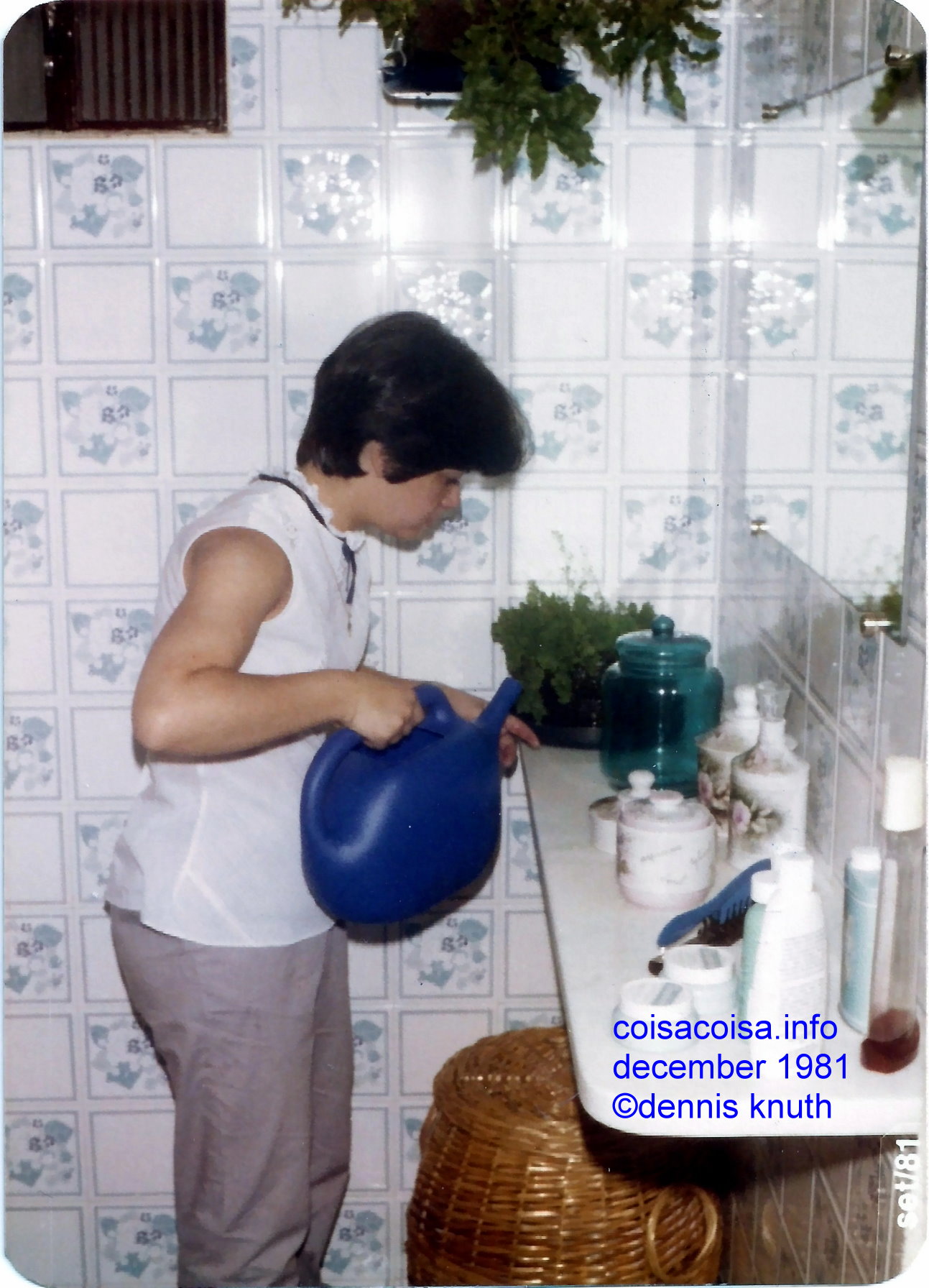 Helenice watering the plants