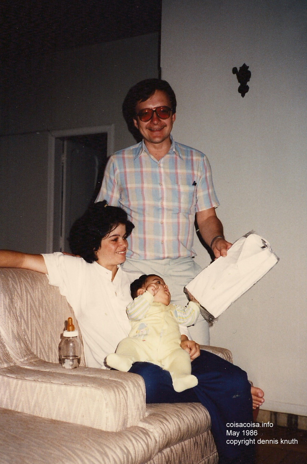 Dennis shows Helenice a new shirt