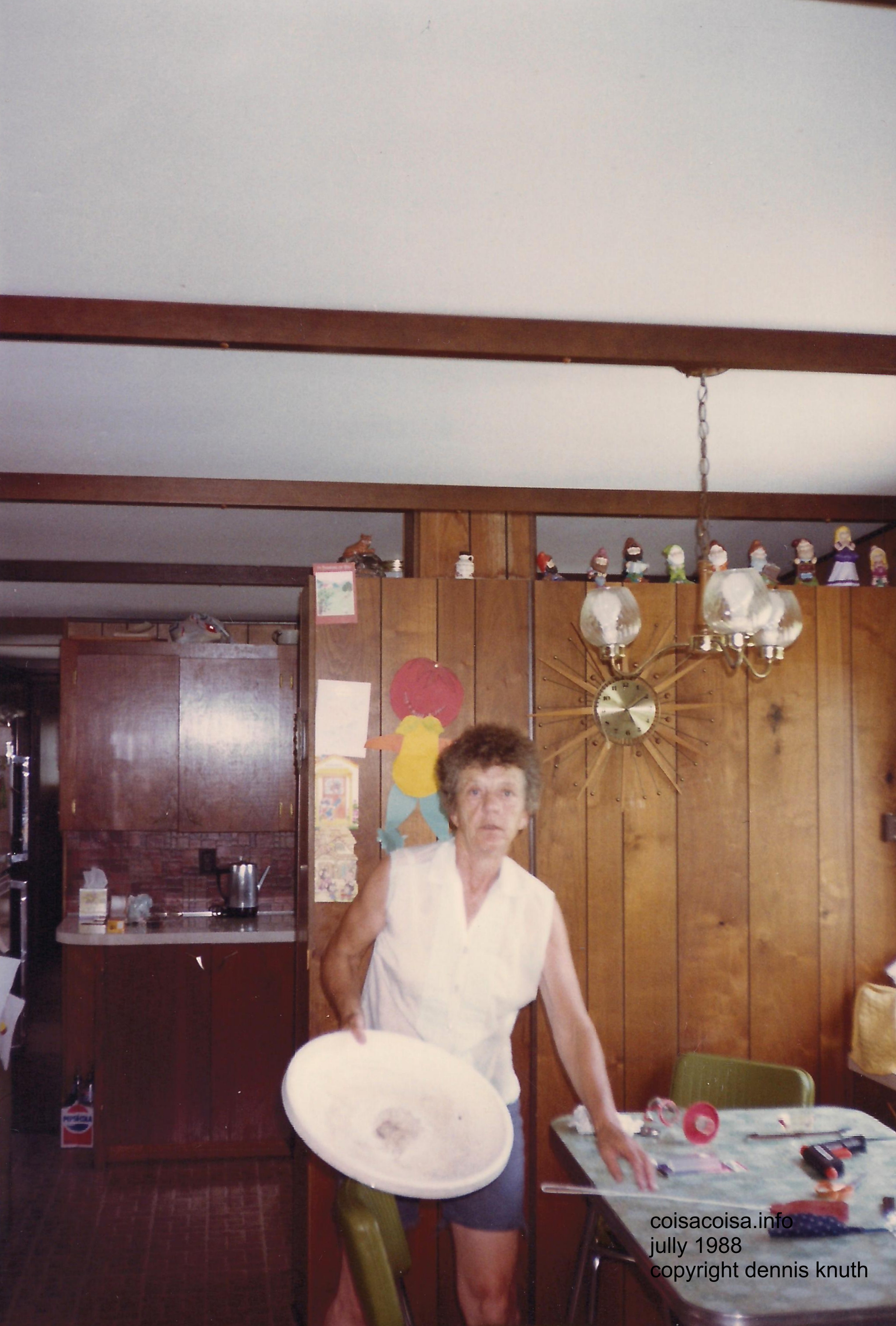 Emogene Knuth fixes Sherri's birdbath with a glue gun