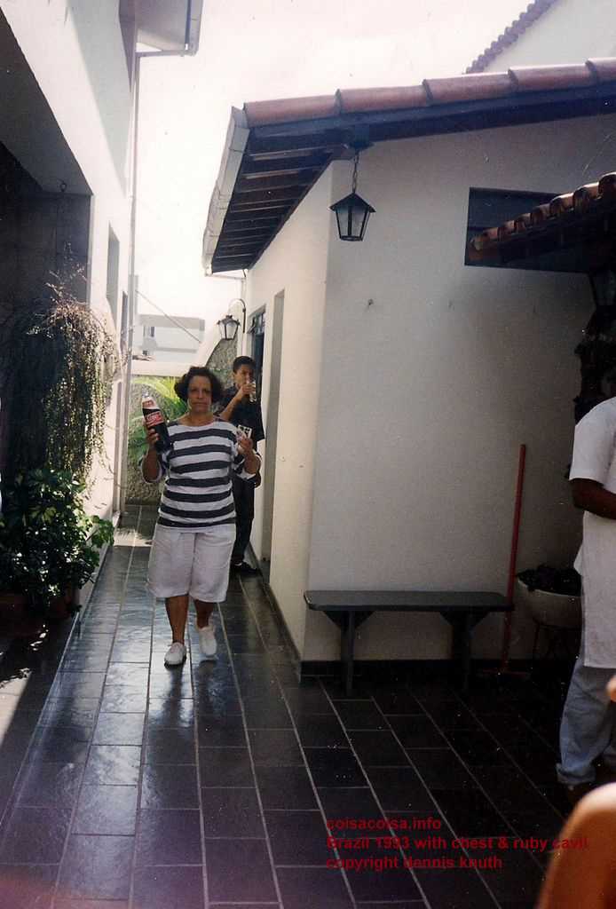 Vicentina brings some soda out to the patio