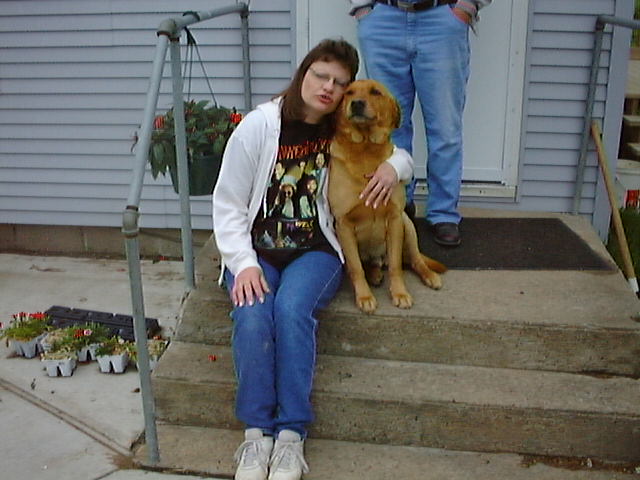 The dog toby and Sherri gives a big hug