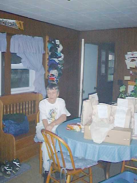 Emogene drinking a beer in the old farm house