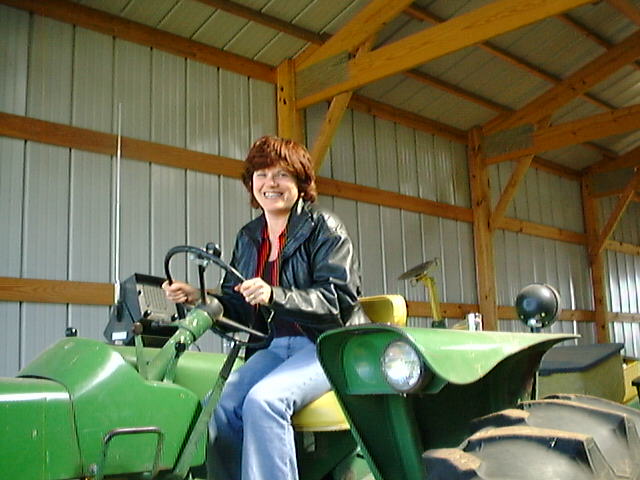 Rose on a John Deere lawn mower in Durand