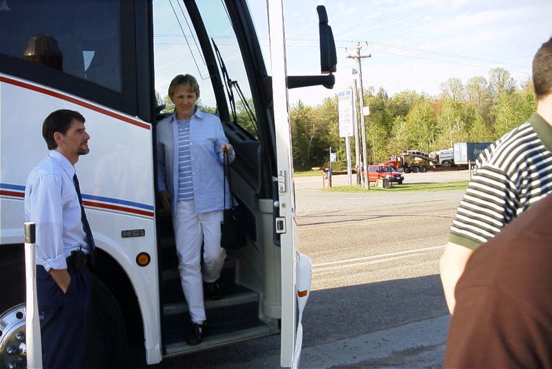 A friend gets off the bus