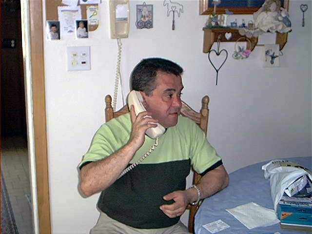 Helton makes a phone call in 2001 on the farm