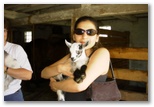Patricia hugs a baby goat