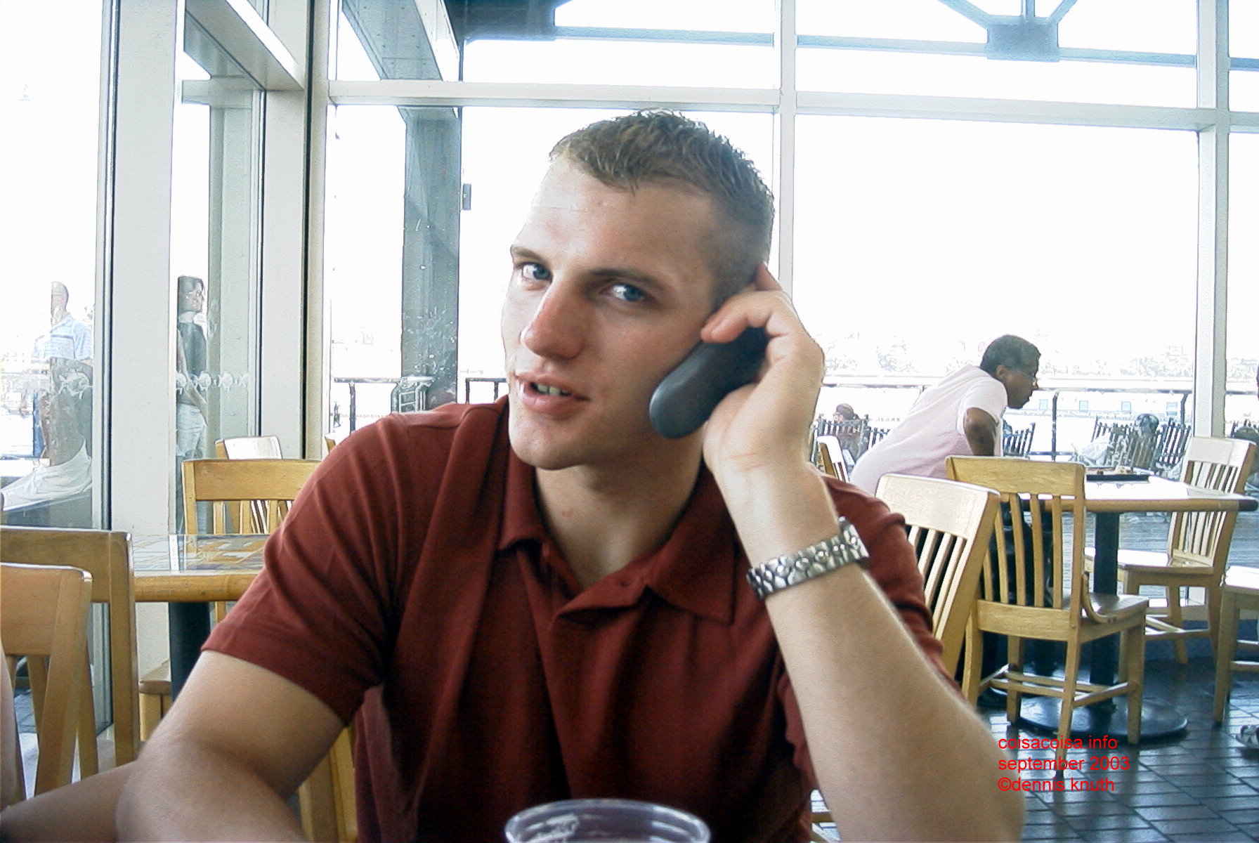 Justin on his cell phone at the pier