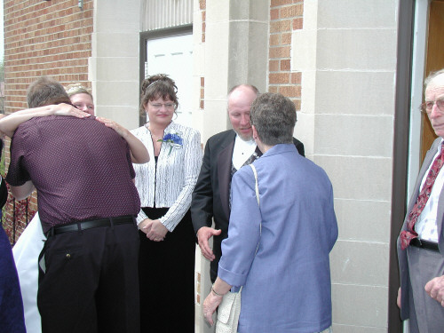 Sherri and Gary greet guests
