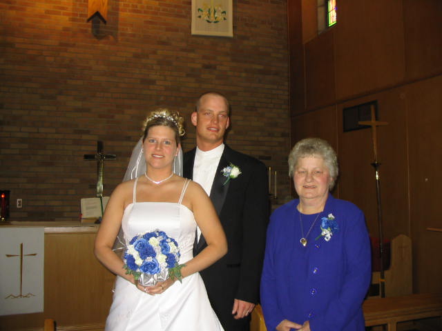 Bride and groom and Alice Sperber