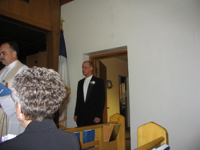 The groom enters the church