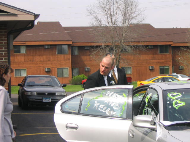 Nate enters the wedding getaway car