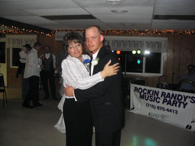 The groom dances with his mother