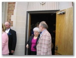 Gloria Goller and Erv Goller exit the church