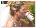 The bride drinking a beer