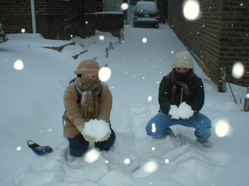 Thaissa and Thacila throwing snow