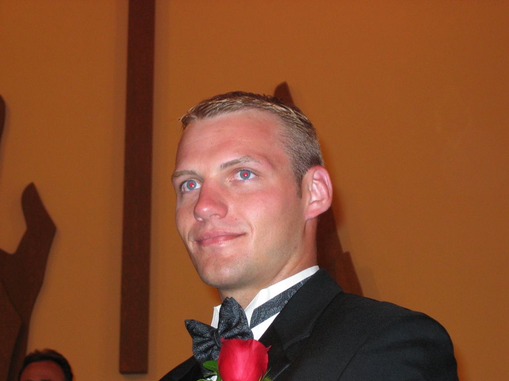 Justin watches as his bride comes into the church