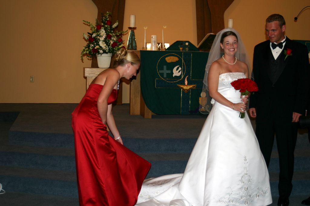 Brides Maid adjust the bridal train