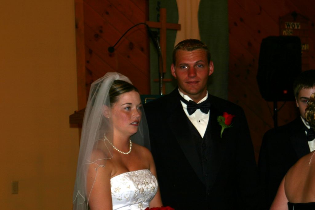 Bewildered newly weds wait for the formal photographs to be taken