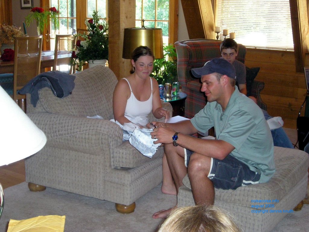 Julia smiles as just opens a gift