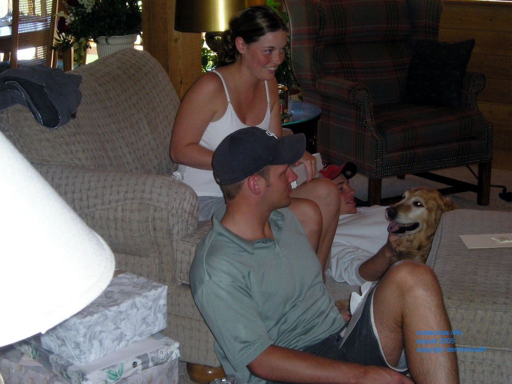 Julia smiles at as the newly weds open the presents