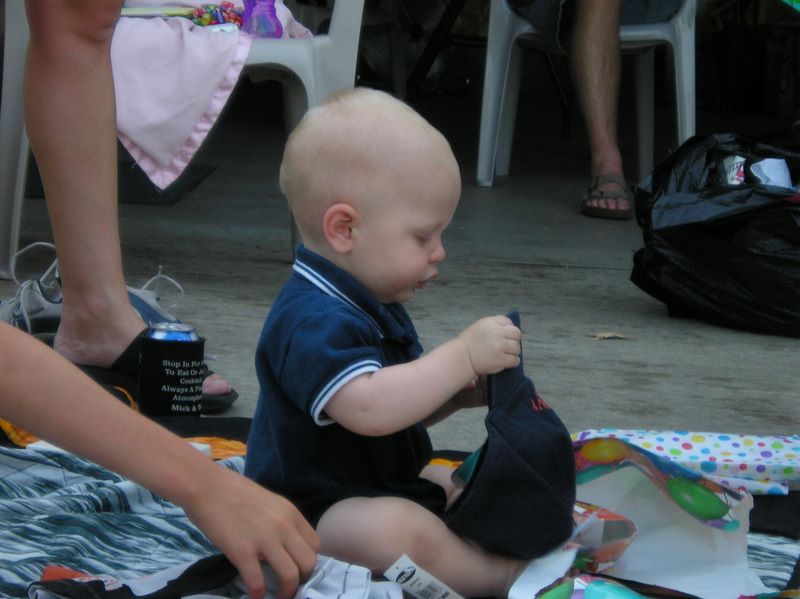 Jared inspects a cap he received as a gift