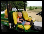 Jared and Kelsey on a John Deere Gator at Sherri and Garys July 29 2006