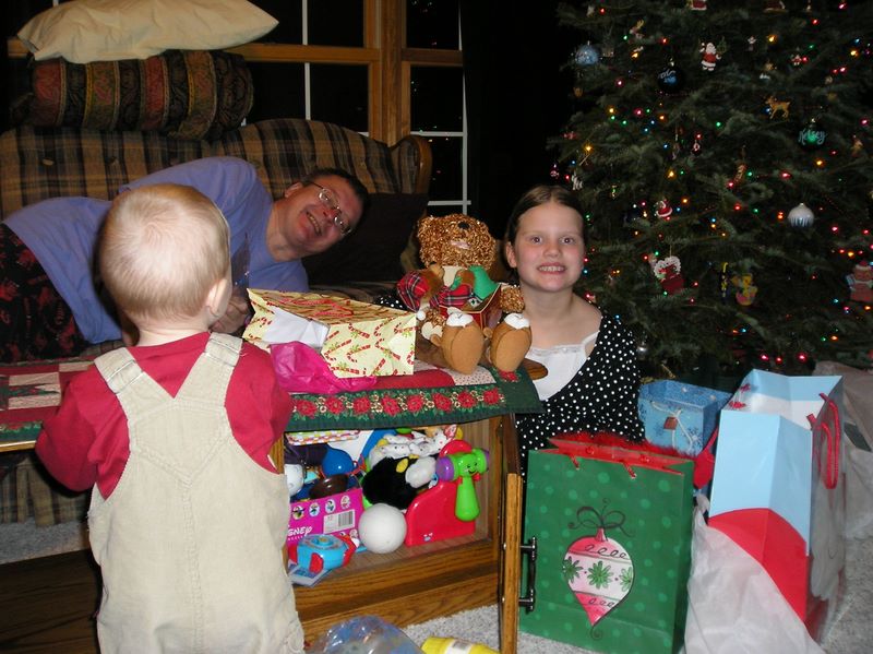 Dennis smiles and Kelsey with her teddy