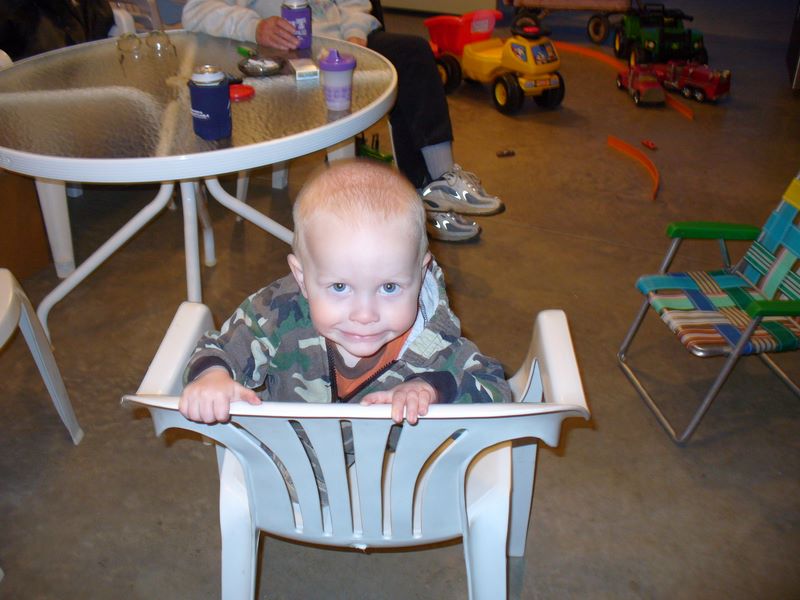 Jared on a Chair in his camouflage shirt