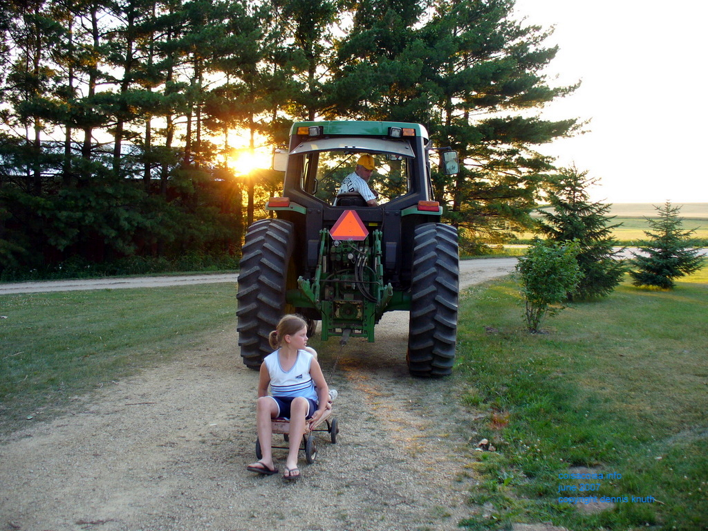 Taking a ride in a rusted red wagon