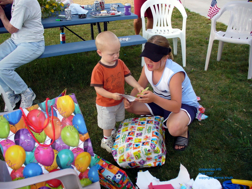 Kelsey reading a birthday card to Jared