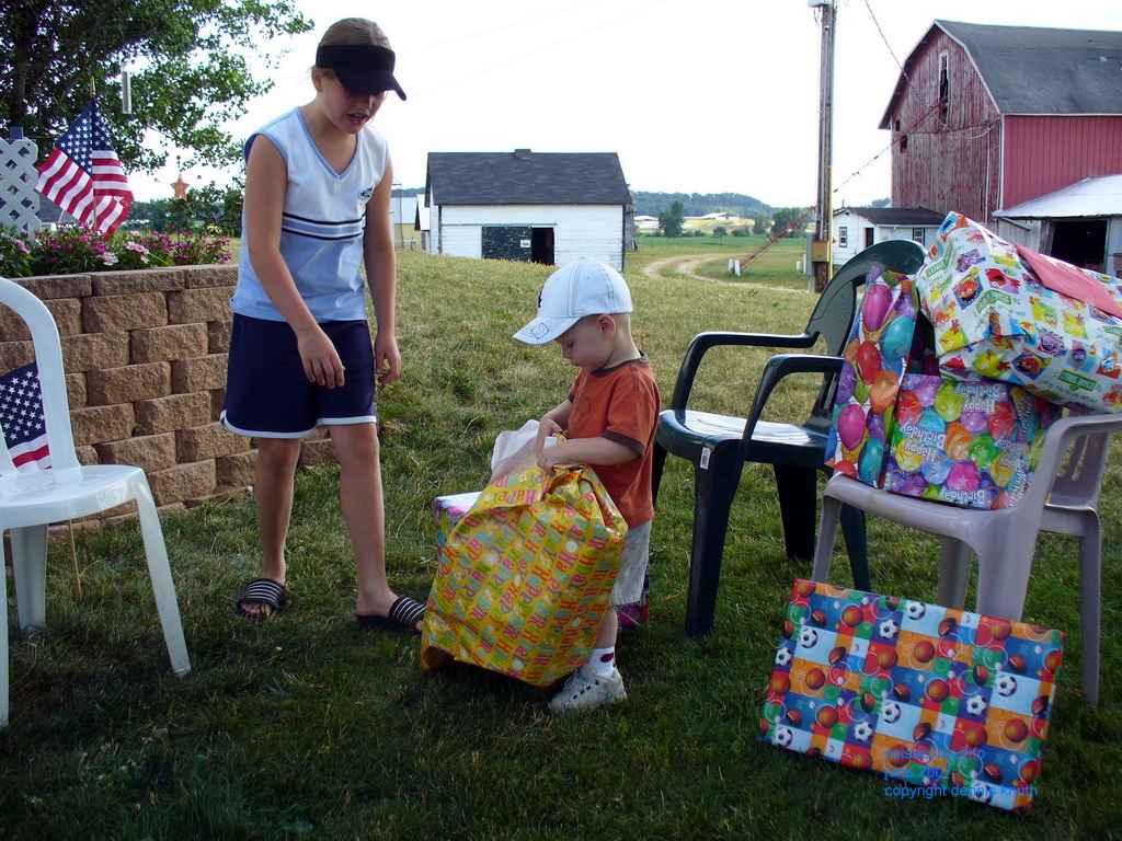 Chairs piled with birthday gifts for Jared