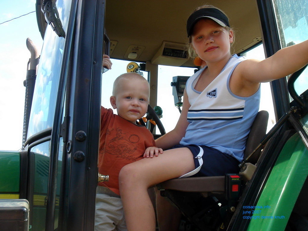 Kelsey and Jared in a tractor cab