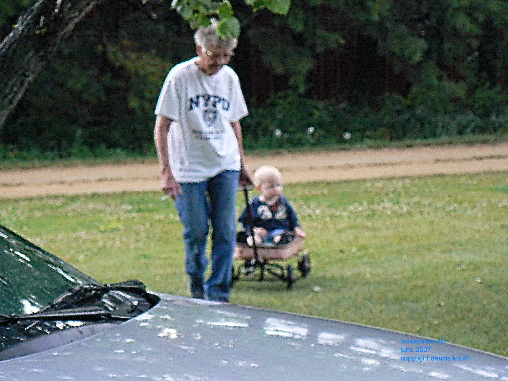 Emogene pulling Jared in the little red wagon