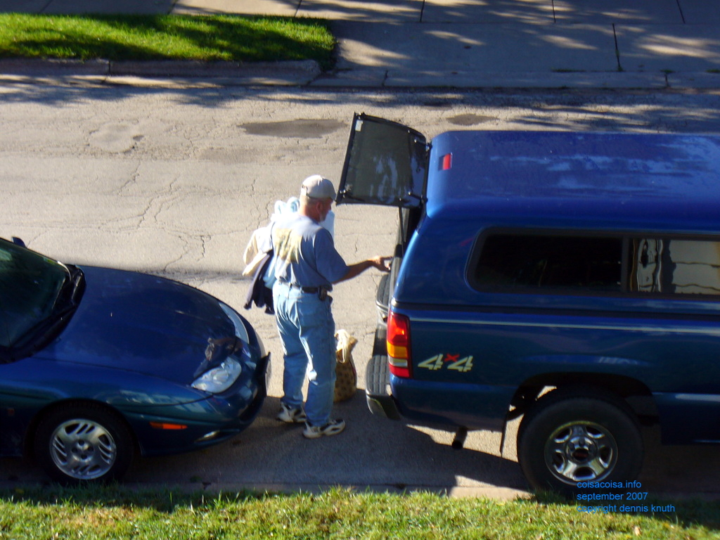 Gary opens his truck to get some things for Kelli
