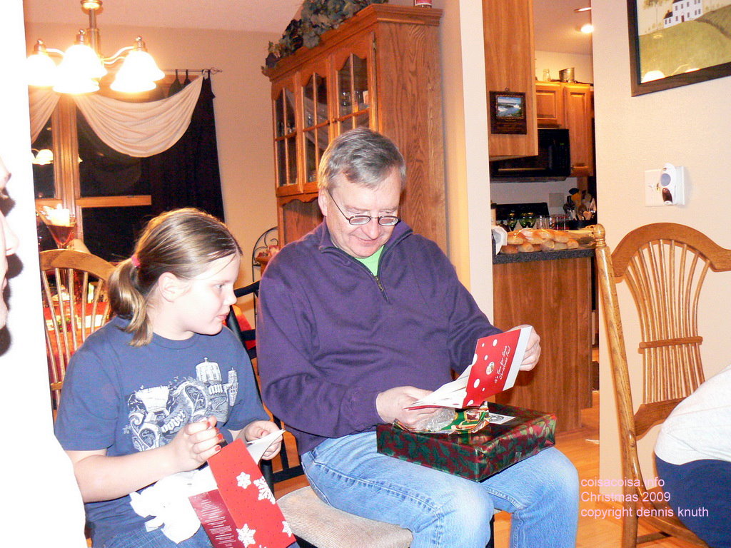 Dennis opens his gifts