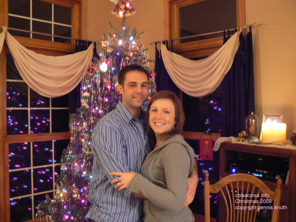 Ed Fattmann and Kaydi Saxe in front of the Christmas Tree