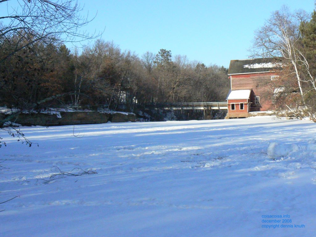 Icy Mill Pond with foot prints