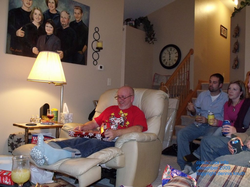 Gary laughts at a reaction of Jared's gift opening