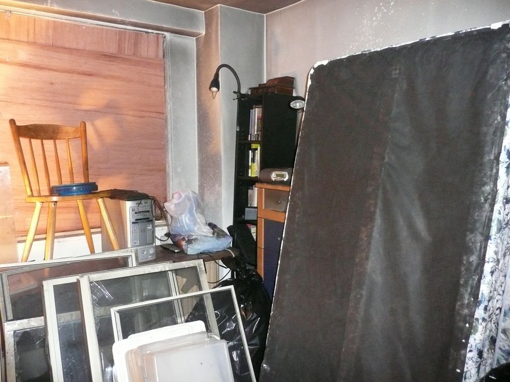 Boarded up Bedroom windows