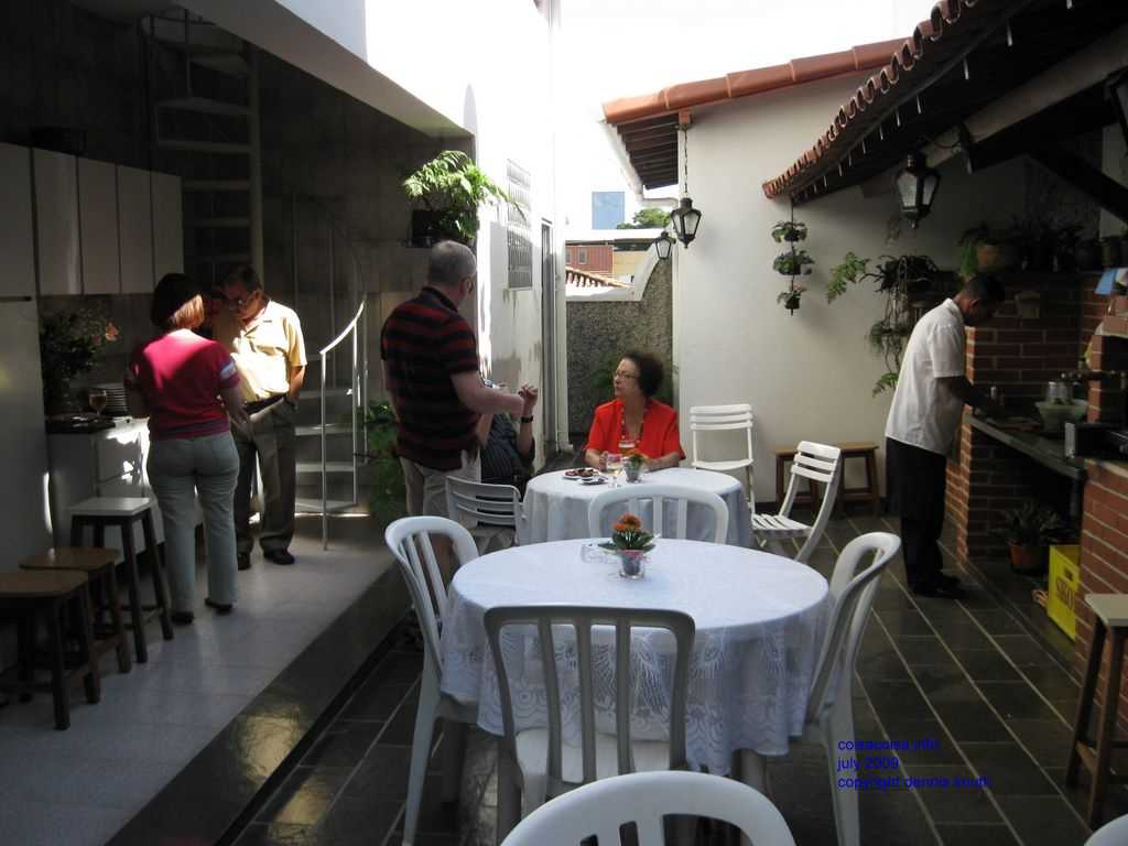 Janine and Dennis chat at the party