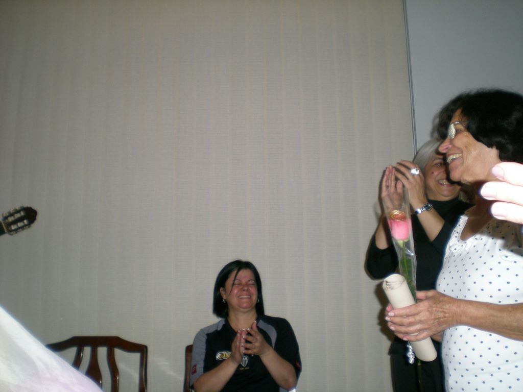 Vicentina holds her 80th birthday proclamation