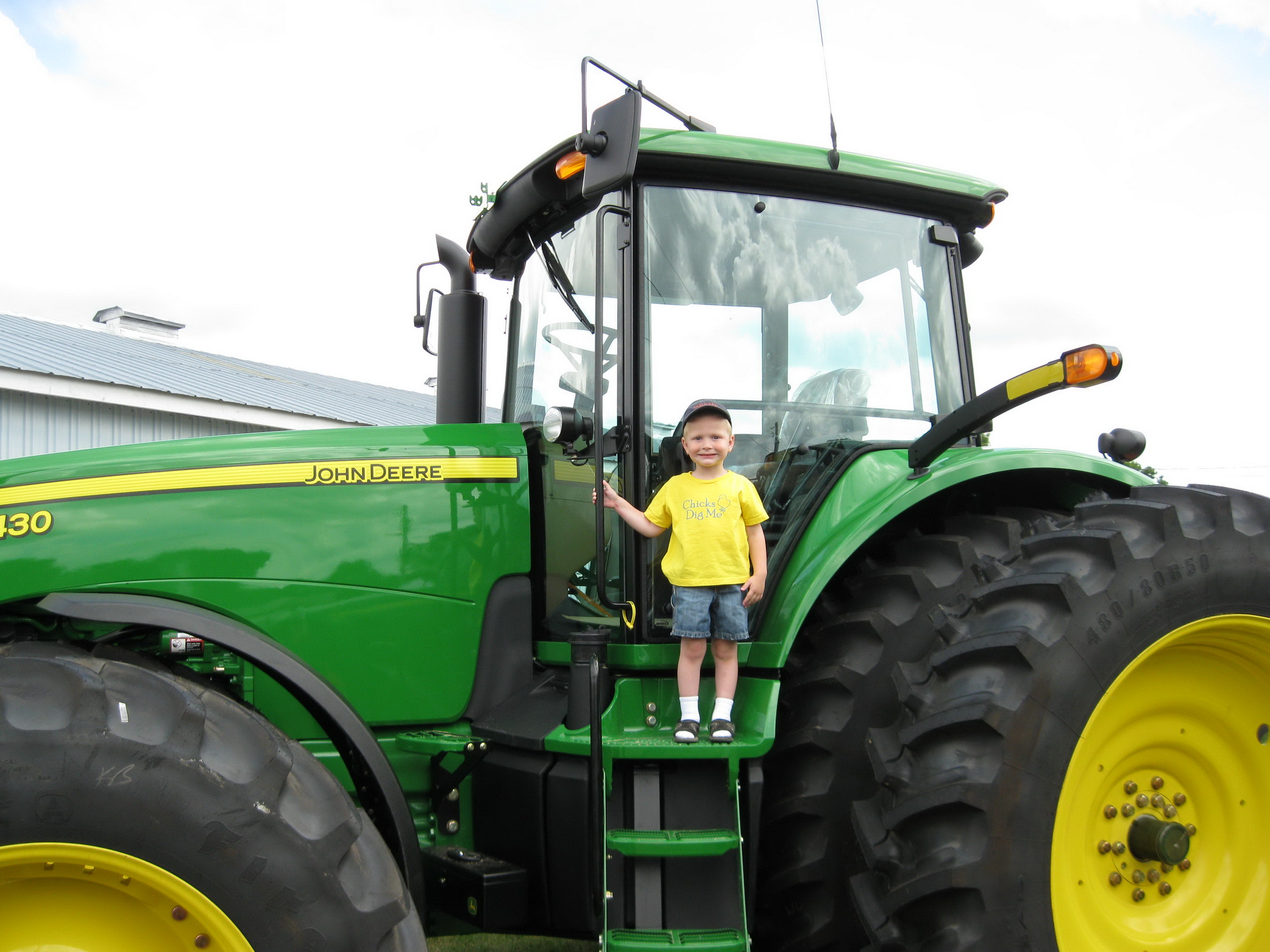 A little guy on a big tractor