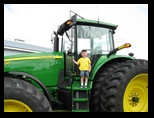 Little Jared on a big big John Deere tractor