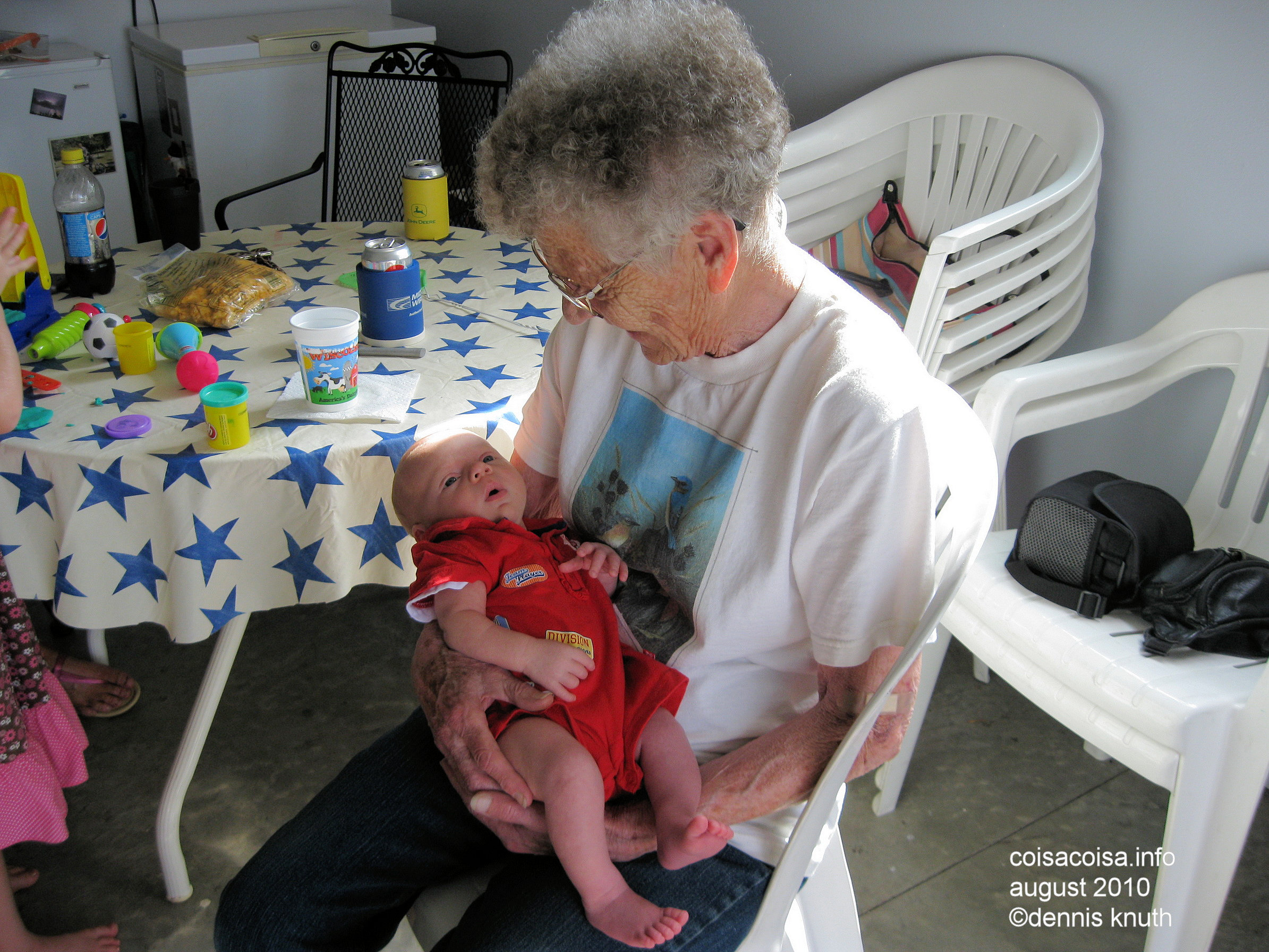 Emogene looks at Greatgrandson with joy
